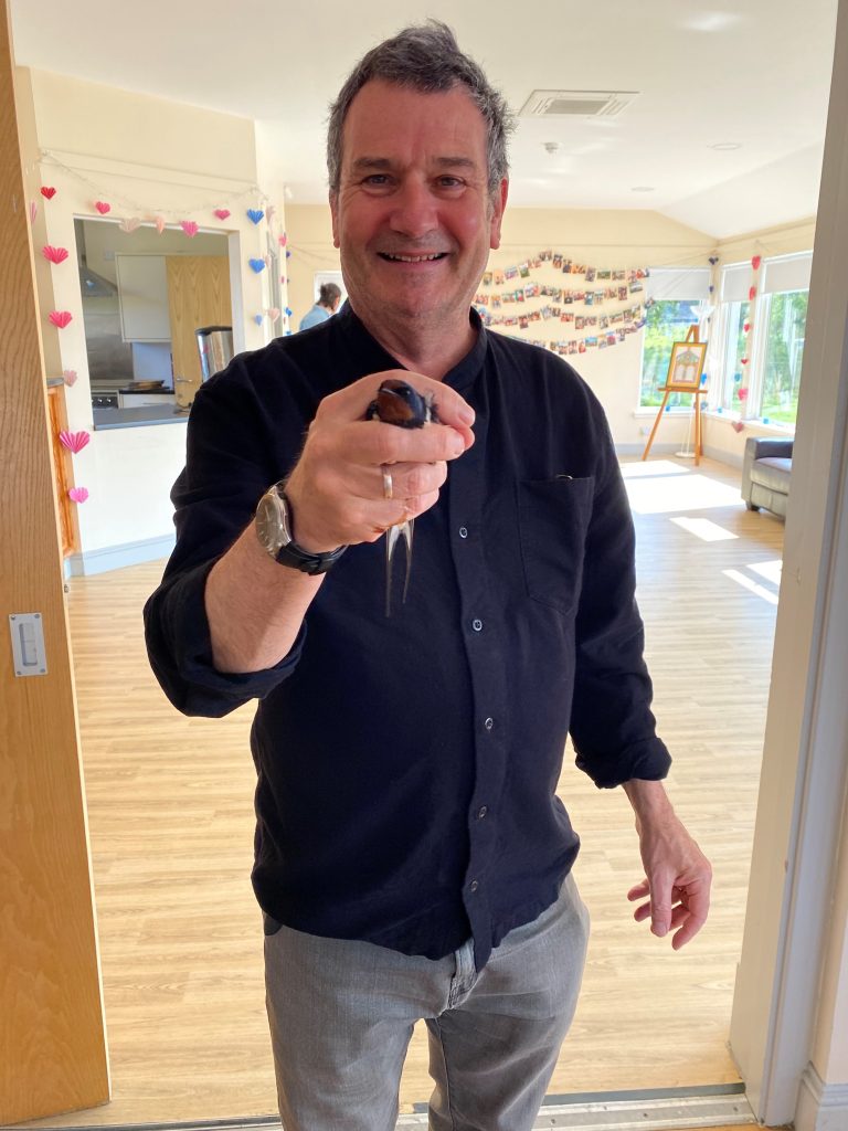 Author and naturalist Mark Cocker with a Barn Swallow